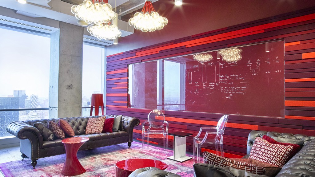 A living room with a couch and a table.